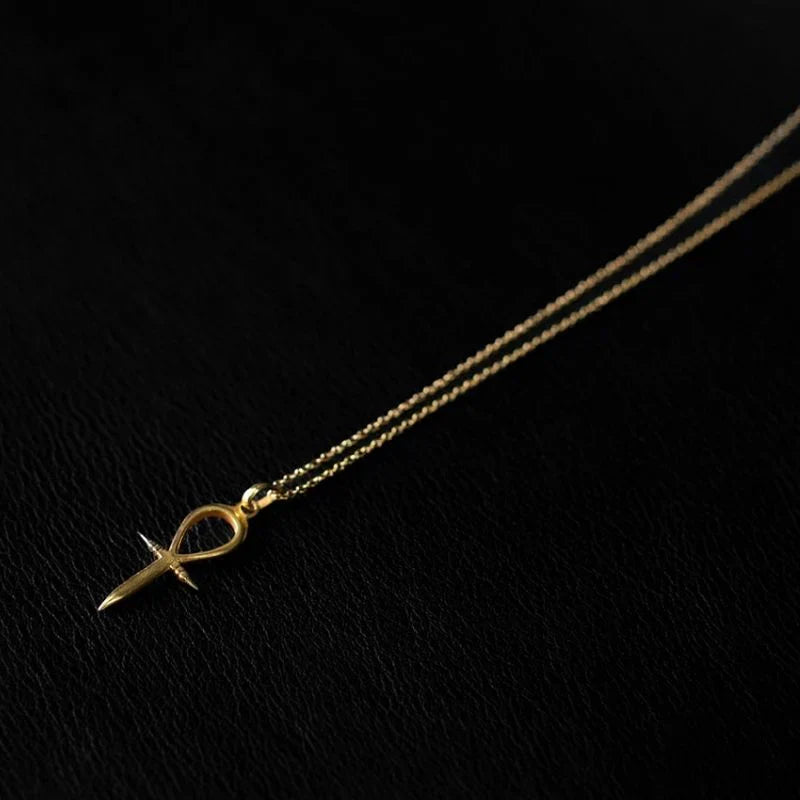 22K gold plated ankh pendant necklace on a 925 sterling silver base, showing the warm gold tone against bare skin.