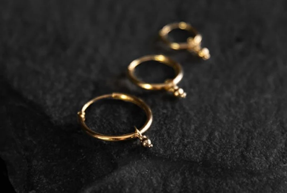 Noir KĀLA 22K gold vermeil small hoops over 925 sterling silver, gold vermeil jewelry that outlasts gold-plated.